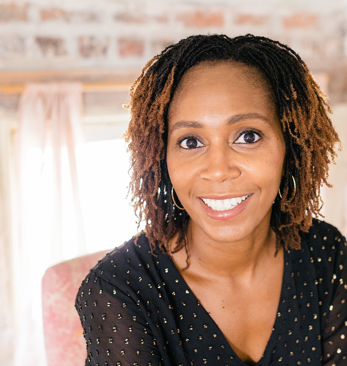 headshot of Amina Harvey Dearmon